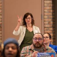 person holding up two fingers